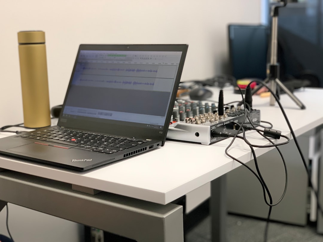 A laptop with distorted sound waves emanating from its speakers, symbolizing audio issues on Linux.
