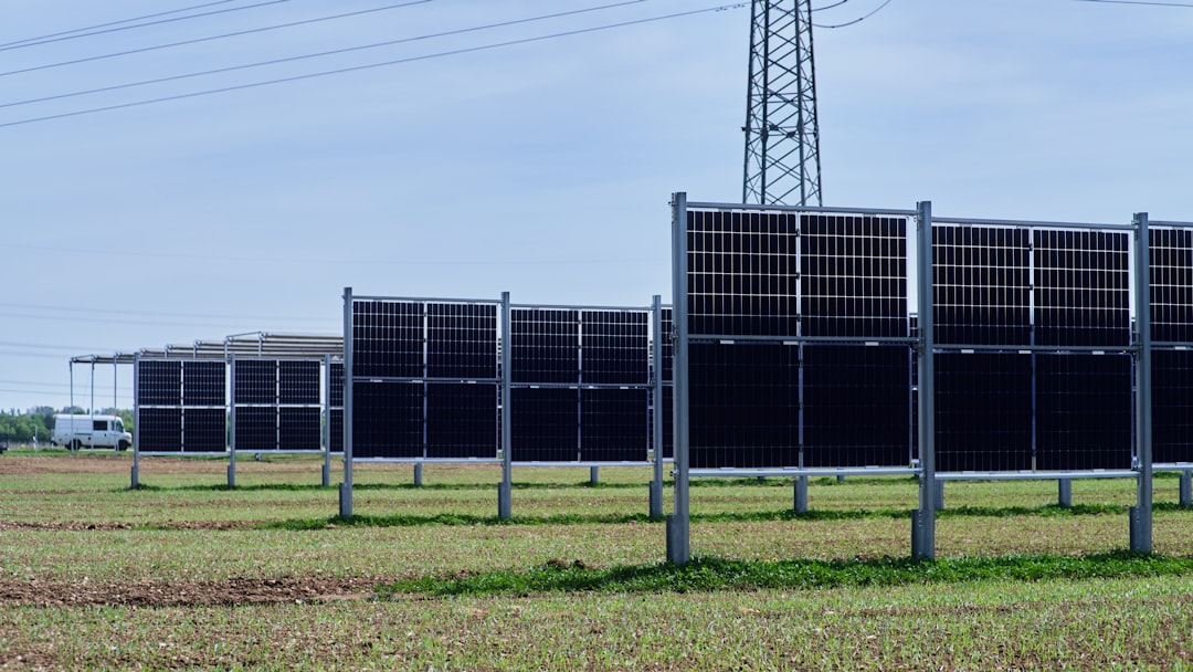 Solar and wind farms connected to a smart grid, with data flowing between them