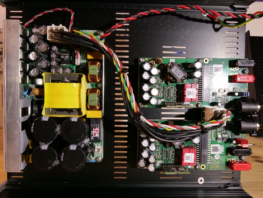 A complex circuit board diagram with highlighted sections indicating audio pathways, representing the intricate nature of kernel audio driver development.